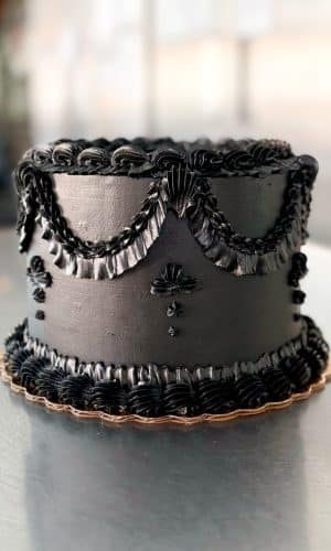 Black Vintage birthday cake by Whipped Bakeshop in Philadelphia, PA